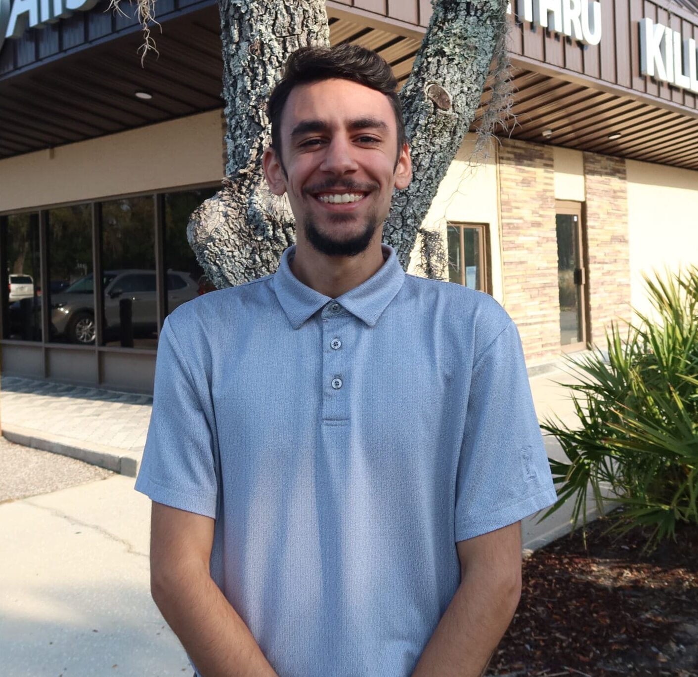Photo of man smiling at camera.