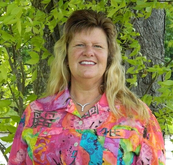Woman smiling at camera for profile picture