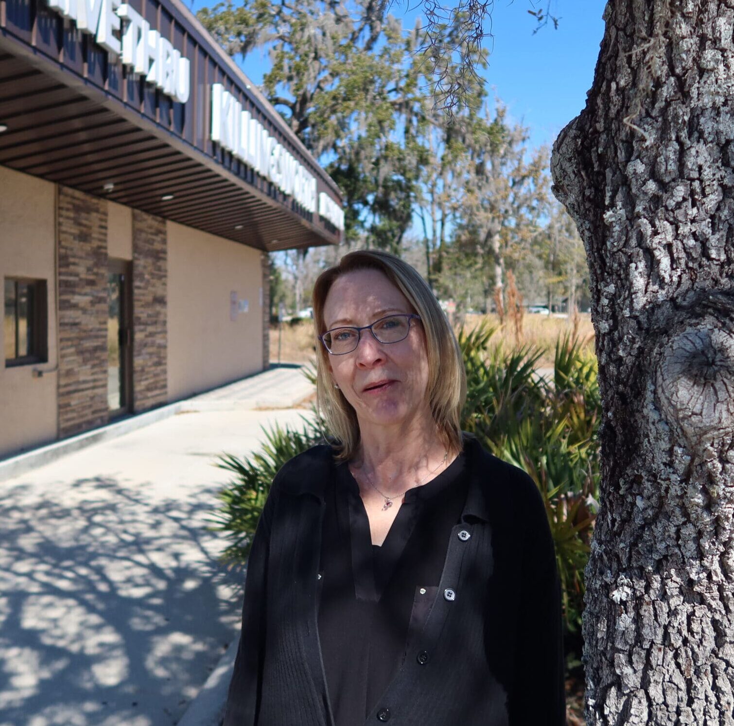 Profile picture of woman smiling at camera.